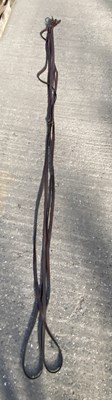 Lot 1311 - Set of brown Pair reins, approx 26ft long