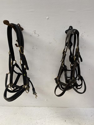 Lot 1314 - Pair of brass-mounted headcollars (one with broken clip) together with three other brass-mounted headcollars