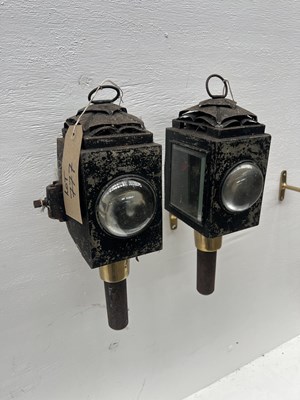 Lot 777 - Pair of black bullseye fronted lamps