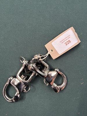 Lot 228 - Pair of stainless steel quick release snaps. This lot carries VAT.