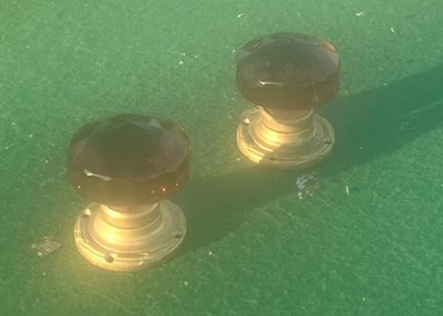 Lot 250 - Pair of amber door knobs for a wagon