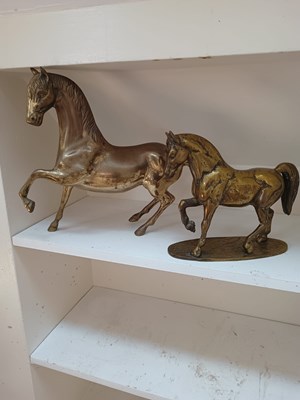 Lot 670 - Two brass horse ornaments