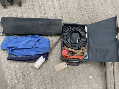 Lot 827 - Spares case with a new waterproof driving apron, two rubber mats with two cotton shaft covers