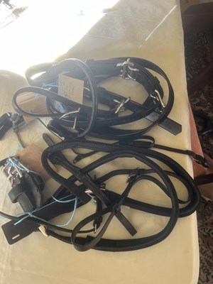 Lot 865 - Selection of nosebands, bridle parts and headcollar