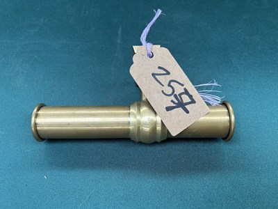 Lot 257 - Brass whip holder.