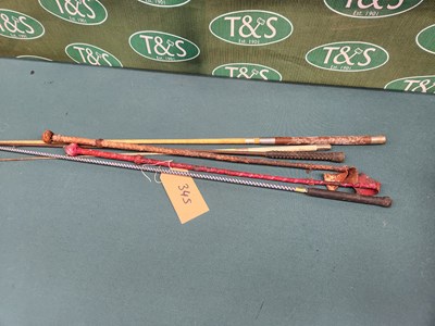 Lot 345 - Four riding whips and two lunge whips