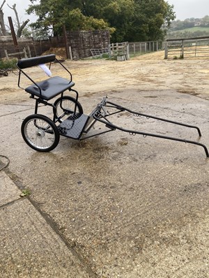 Lot 37 - EXERCISE CART, on pneumatics, to suit a pony; painted black with black vinyl seating.