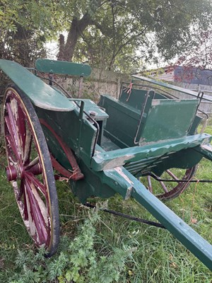 Lot 38 - FLOAT, painted dark green on red 16 spoke wheels with yellow lines