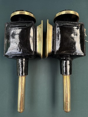 Lot 799 - Pair of black and brass lamps