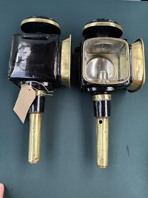 Lot 800 - Pair of black and brass lamps