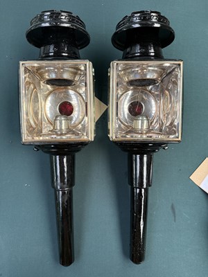 Lot 801 - Pair of black and white metal lamps