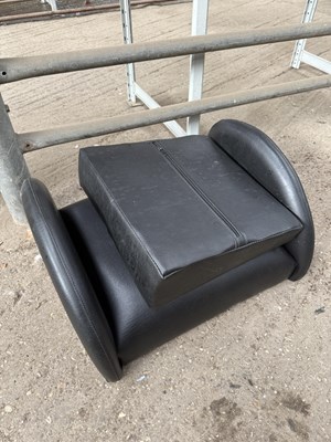 Lot 265 - Wedge cushion in black vinyl together with a...